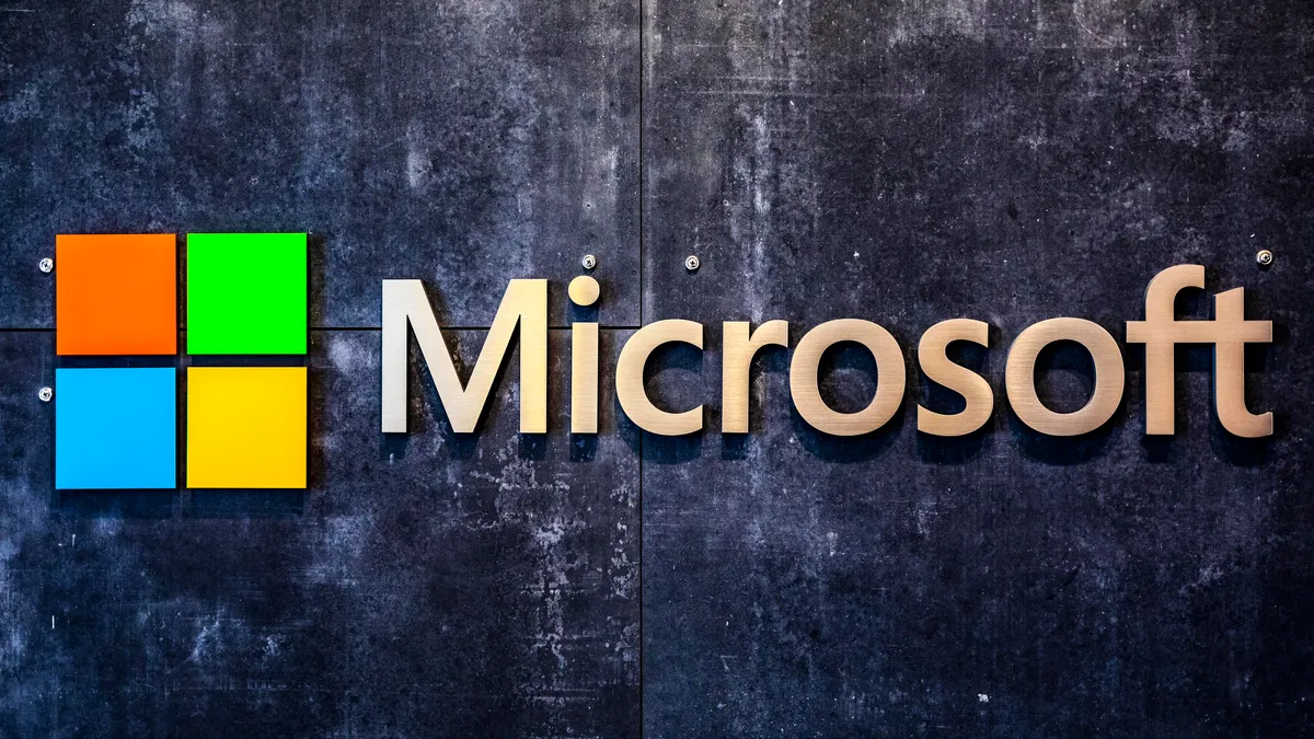 Microsoft logo on a dark textured wall